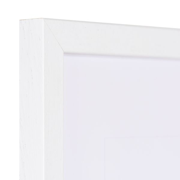 Vista de la esquina de un marco de madera blanco con estructura de madera visible y borde estrecho
