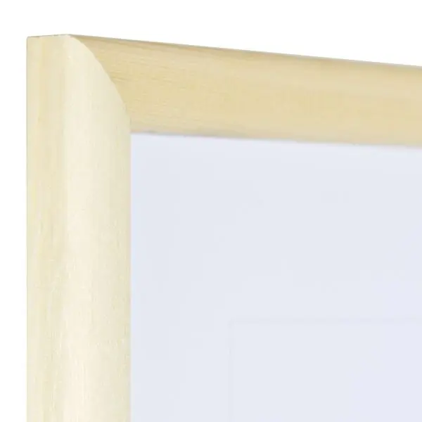 Vista de la esquina de un marco de madera natural con perfil semicircular estrecho y sencillo